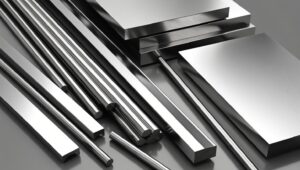 Close-up of 330 stainless steel rods, bars, and sheets arranged neatly on a reflective surface.